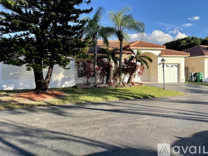 A house with a tree in front of it.
