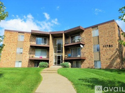 A brick apartment building with the number 11781 on the side.