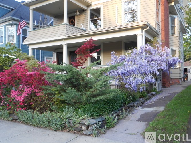 A house with a well-maintained garden in front.