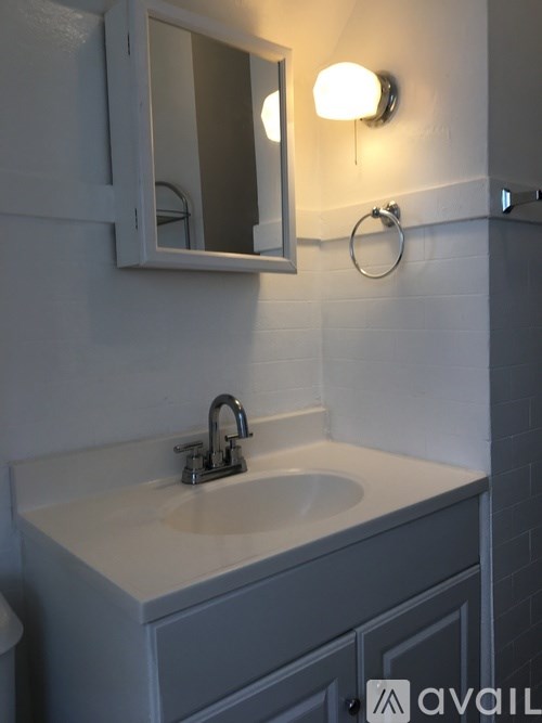 A bathroom sink with a mirror above it.