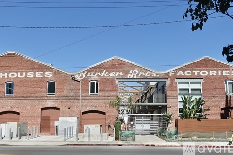 A building with a sign that says "Houses Parker Bros. Factories".