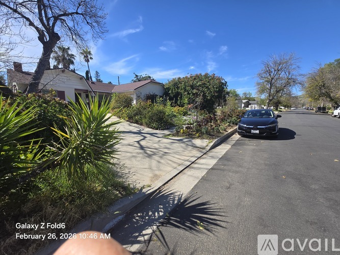 A house with a car parked in front of it.