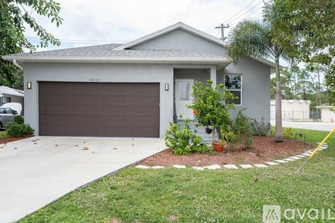 A house with a brown garage door and a white wall.