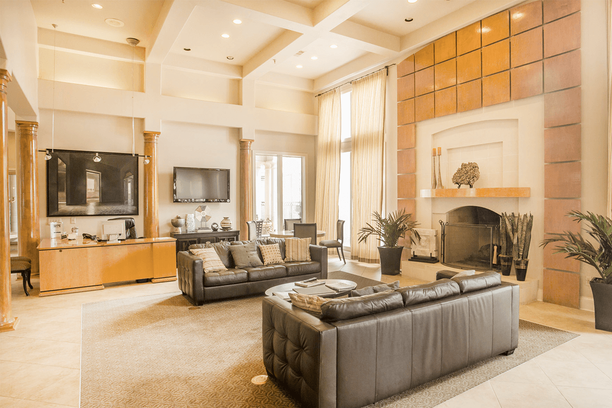 a living room with couches and a fireplace