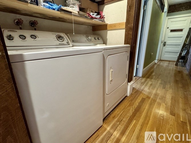 A laundry room with a washer and dryer.
