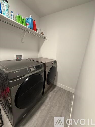 A laundry room with a washer and dryer.