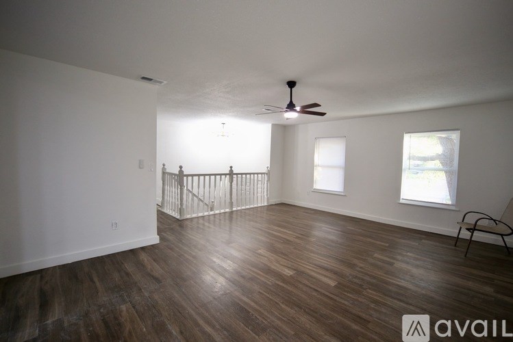 A bathroom with beige tiled walls and floor.