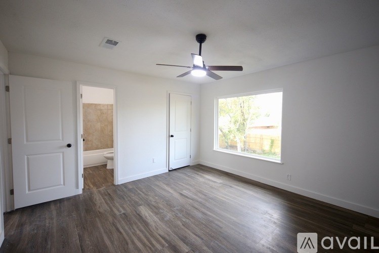 A kitchen with a sink, stove, and refrigerator.