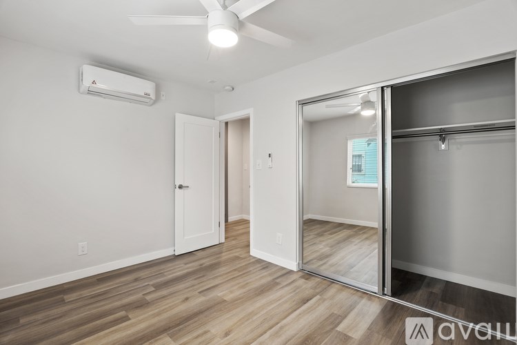 A building with a balcony and stairs leading to the second floor.