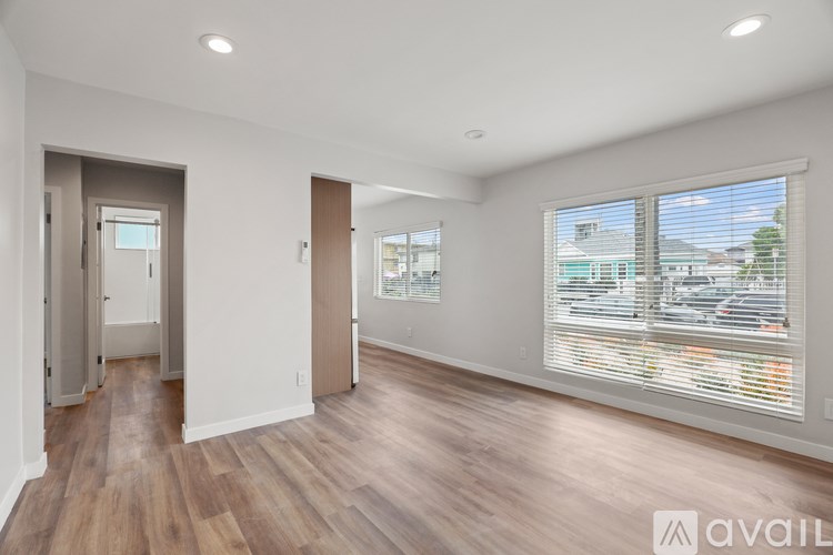 A modern house with a wooden exterior and a staircase leading to the entrance.