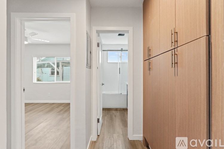 A modern two-story house with a balcony and a garage.