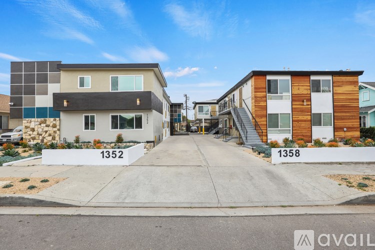 A row of modern houses numbered 1352 and 1358 are for sale.