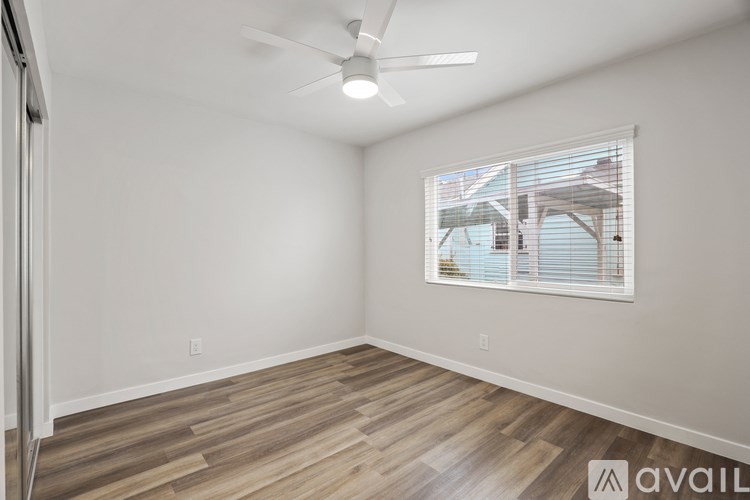 A two-story apartment building with a balcony on the second floor.