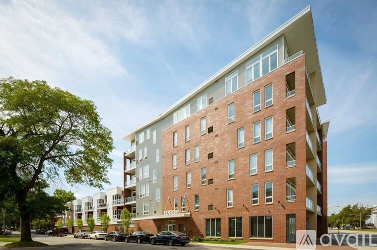 A modern apartment building with a mix of brick and panel facades.