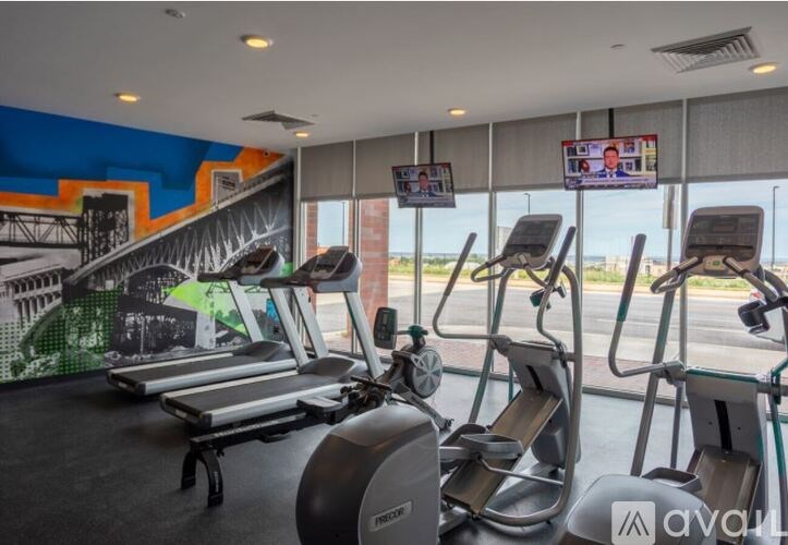 A gym with treadmills and exercise equipment.