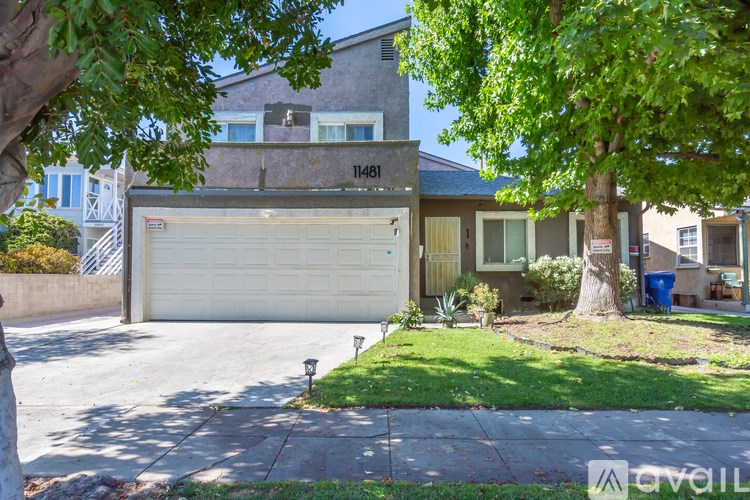 A house with the number 11481 on the garage door.