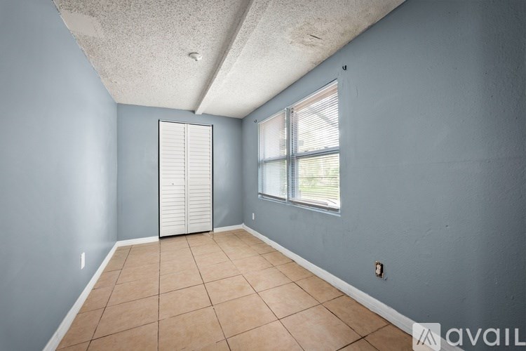 A room with a sliding door and a window.