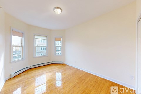 A bathroom with a sink, toilet and a mirror.