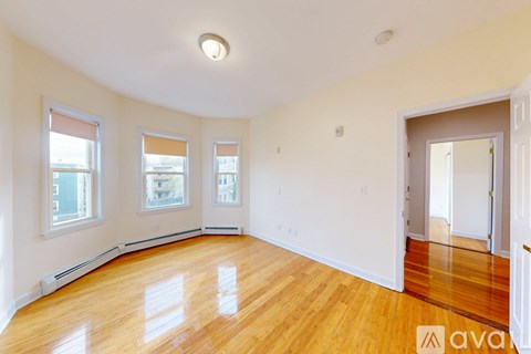 A bathroom with a toilet, sink, and bathtub.