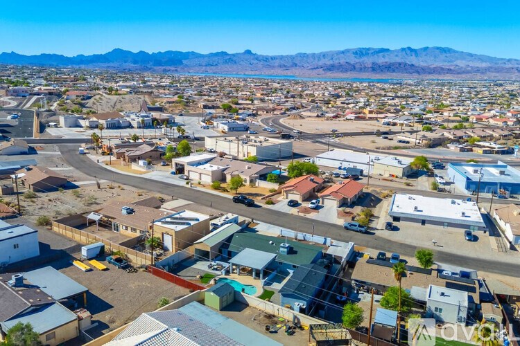 A small town with a lot of buildings and a mountain in the background.