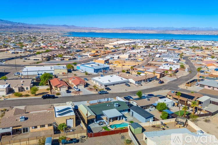 A small town with a large body of water in the background.