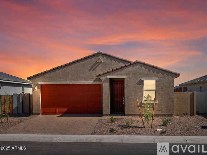 A house with a red garage door is for sale.