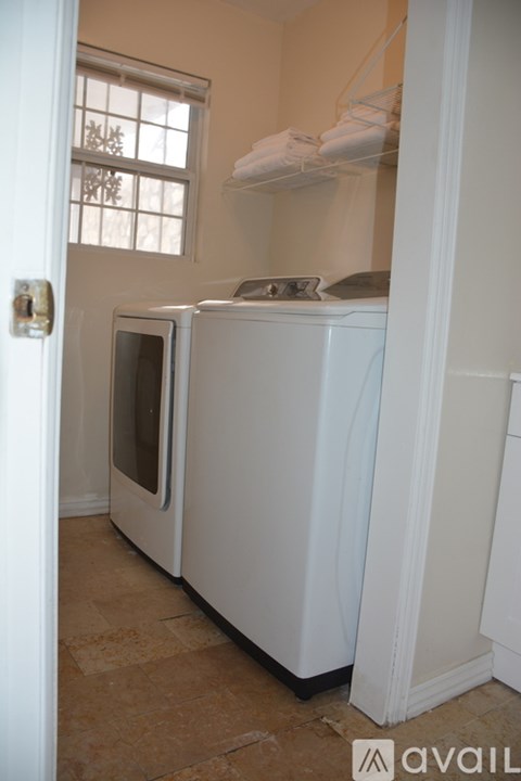 A white fridge and microwave in a kitchen.