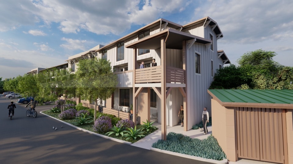 A modern apartment complex with a green roof and a bicycle parked outside one of the units.
