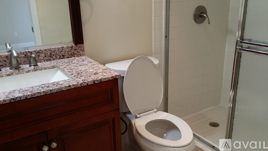 A bathroom with a toilet and sink.
