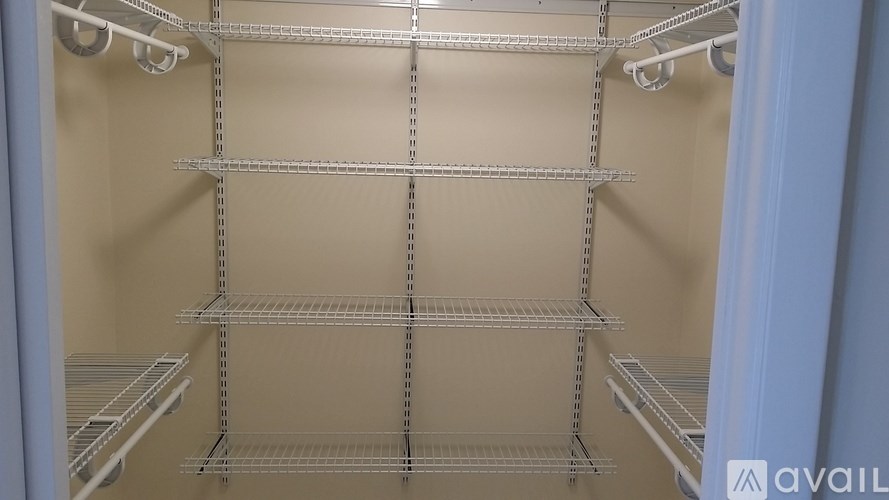 Empty shelves in a refrigerator.