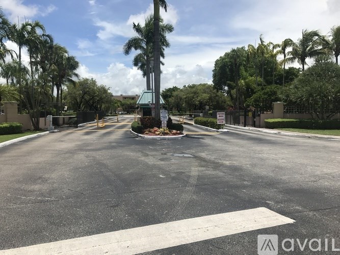 A road with a white line in the middle and a sign on the right side.