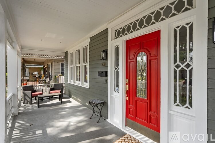 A red door is on the right side of the image.