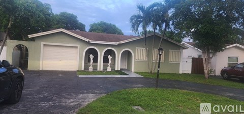 A house with a brown roof and a white garage door is available for sale.