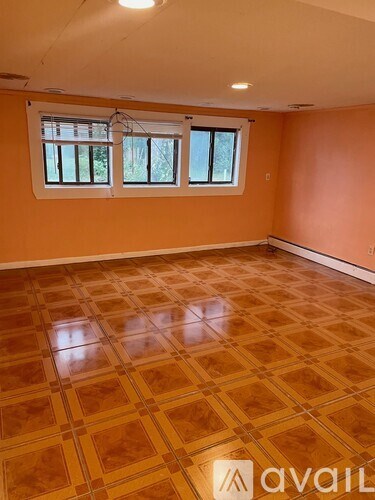A room with orange walls and a tiled floor.