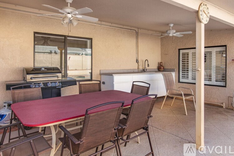 A patio with a table and chairs is available for rent.