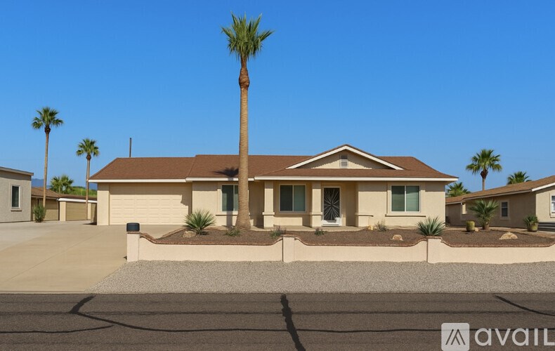 A house with a palm tree in front of it.