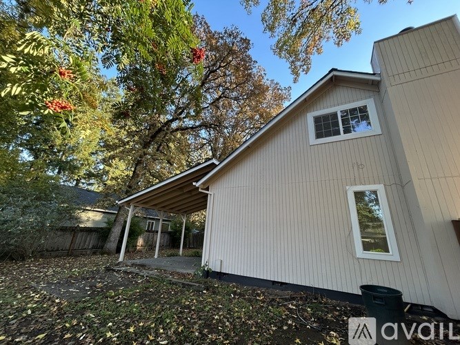 A kitchen with a black oven and a black microwave above it.