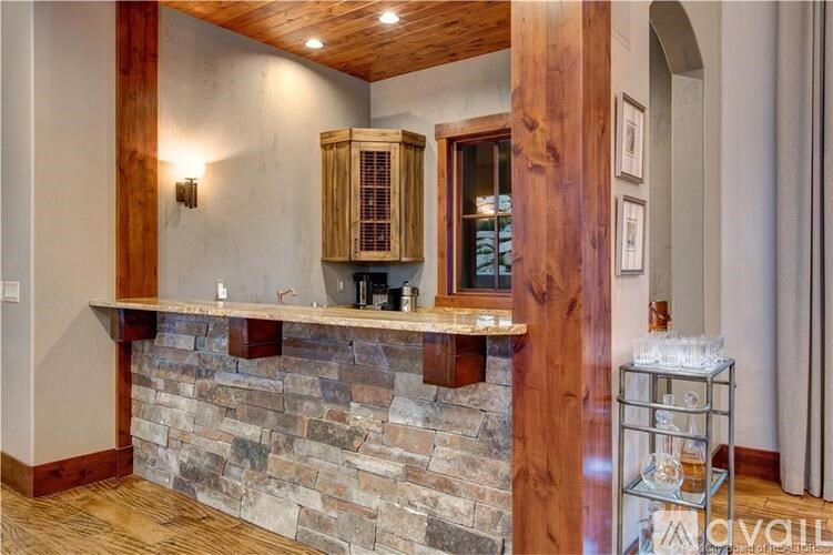 A stone wall with a wooden beam above it.