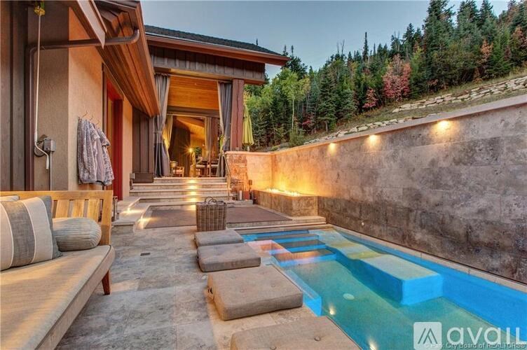 A modern house with a pool in the backyard.