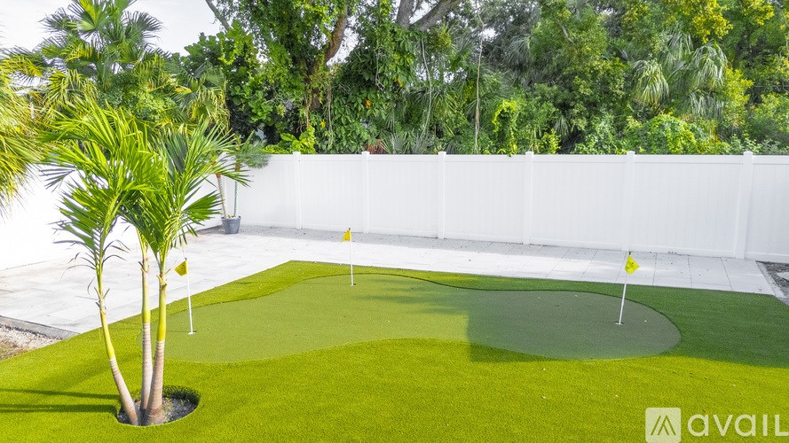 A small laundry room with a washer and dryer.