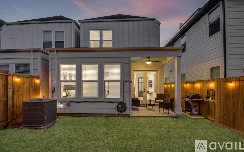 A house with a patio and a hot tub.
