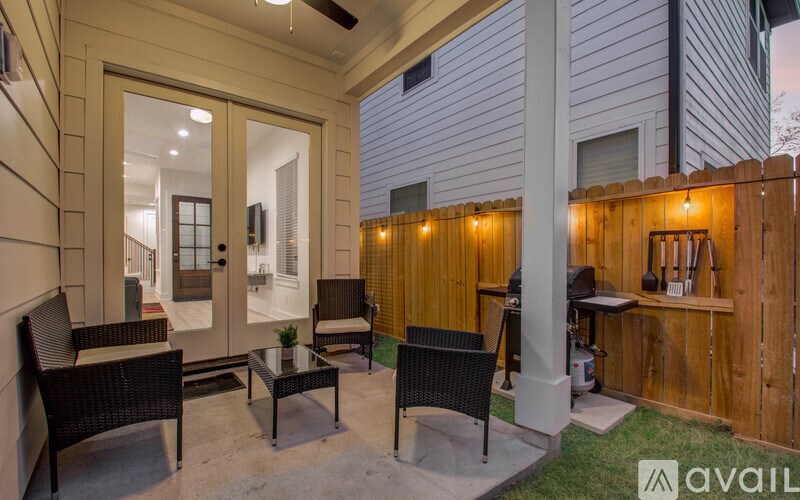 A patio with a table and chairs is shown.