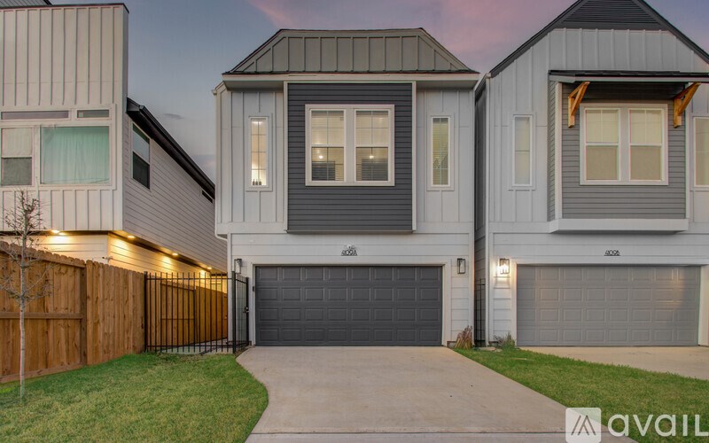 A modern house with a garage is available for sale.