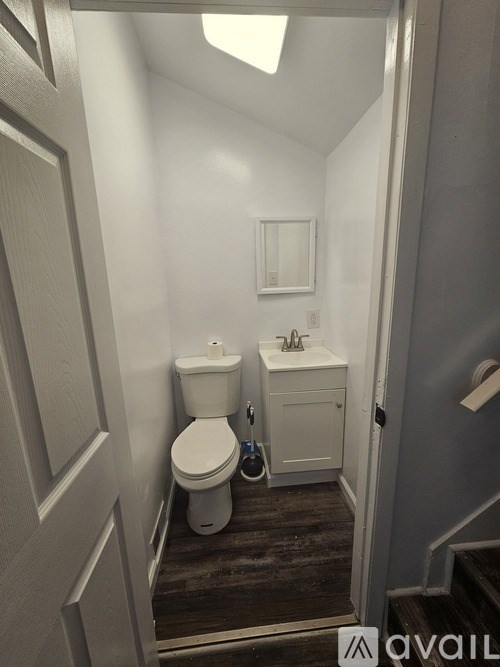A small bathroom with a toilet and sink.