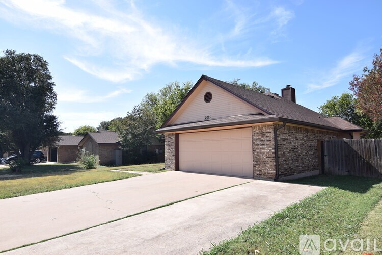 A house with a garage is for sale.