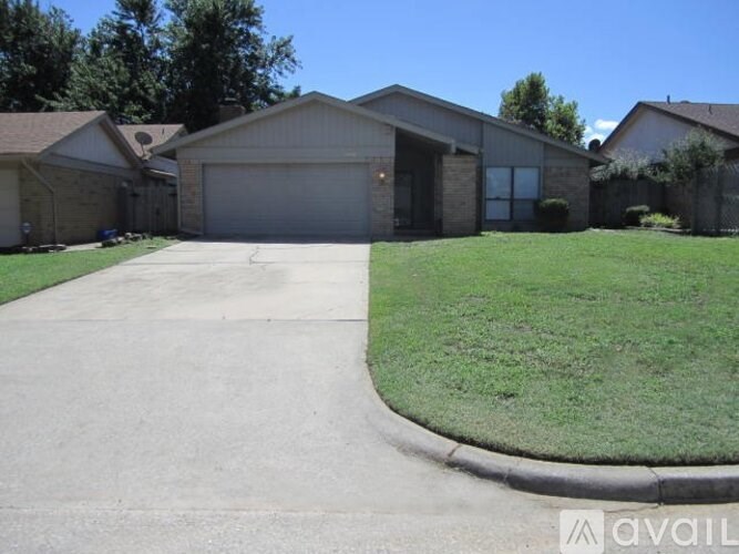 A house with a driveway in front of it.