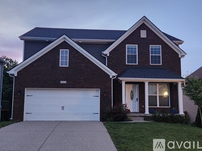 A house with a garage and a front porch.