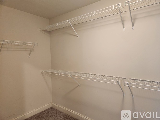 Empty white shelves in a room.
