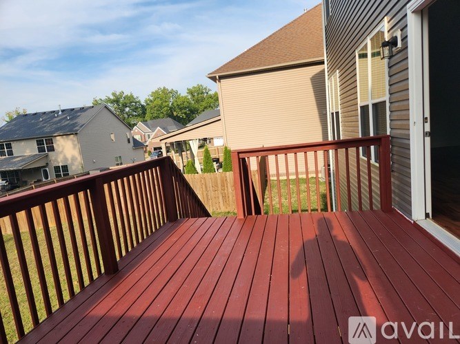 A wooden deck with a shadow of a person on it.