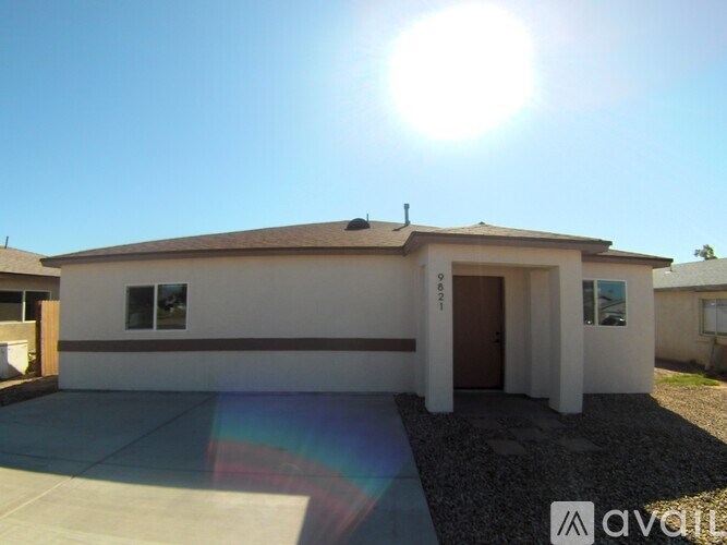 A house with a brown roof and a white garage door.